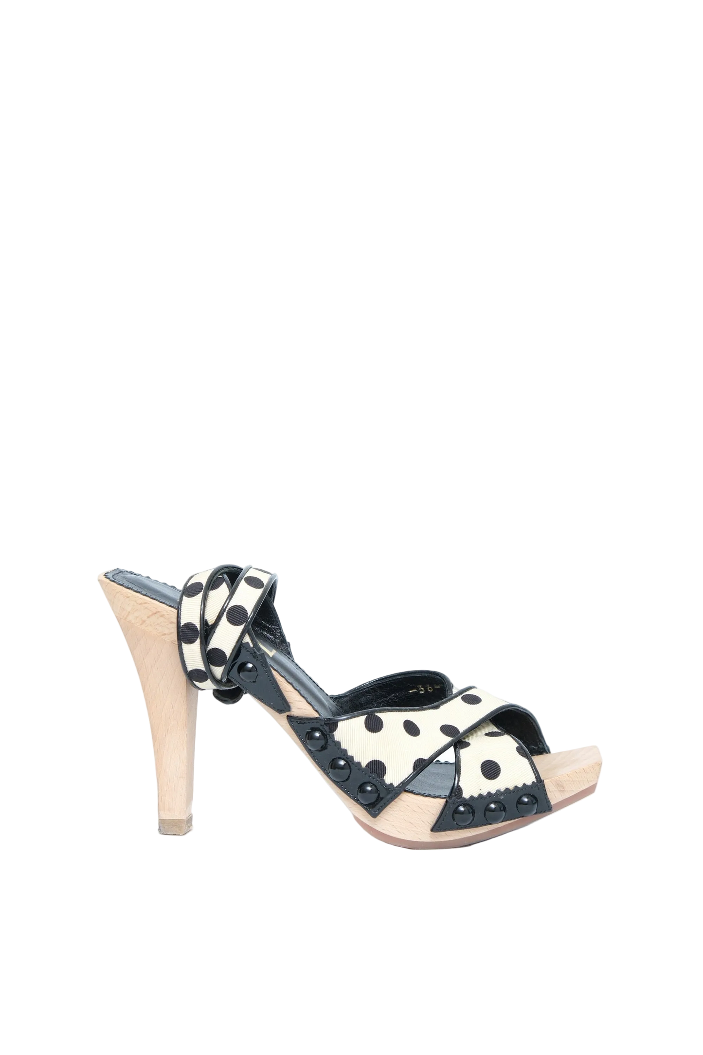 A single women's high-heeled sandal with black and white polka dot straps, a beige platform sole, and a light beige stiletto heel, shown against a plain white background.