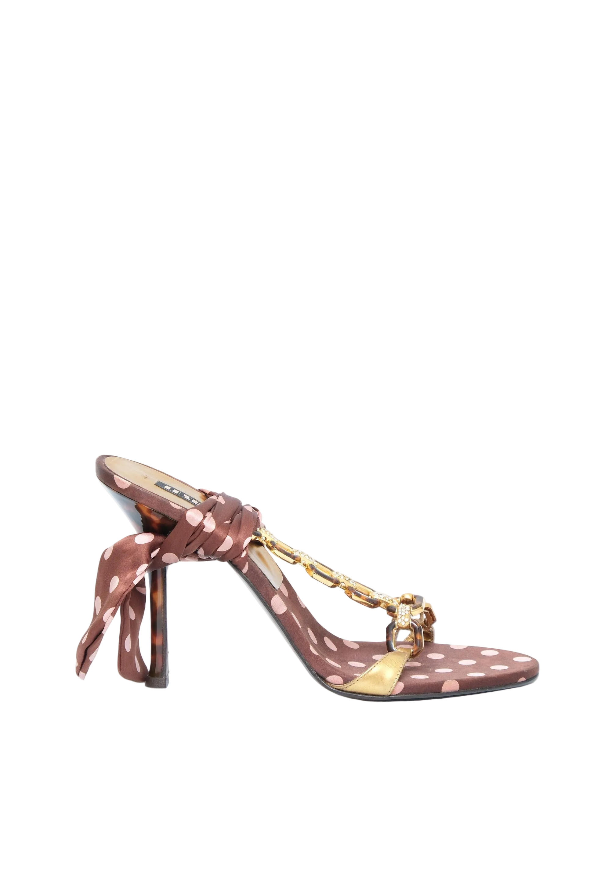A single brown satin sandal with white polka dots, a high stiletto heel, and a gold chain detail across the toe, shown against a plain white background.