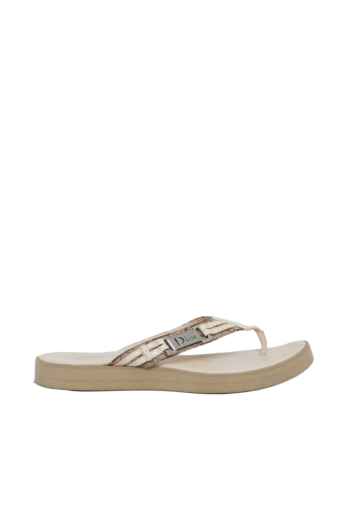 A single Dior flip-flop sandal in beige and metallic gold, shown from a side profile against a light background.