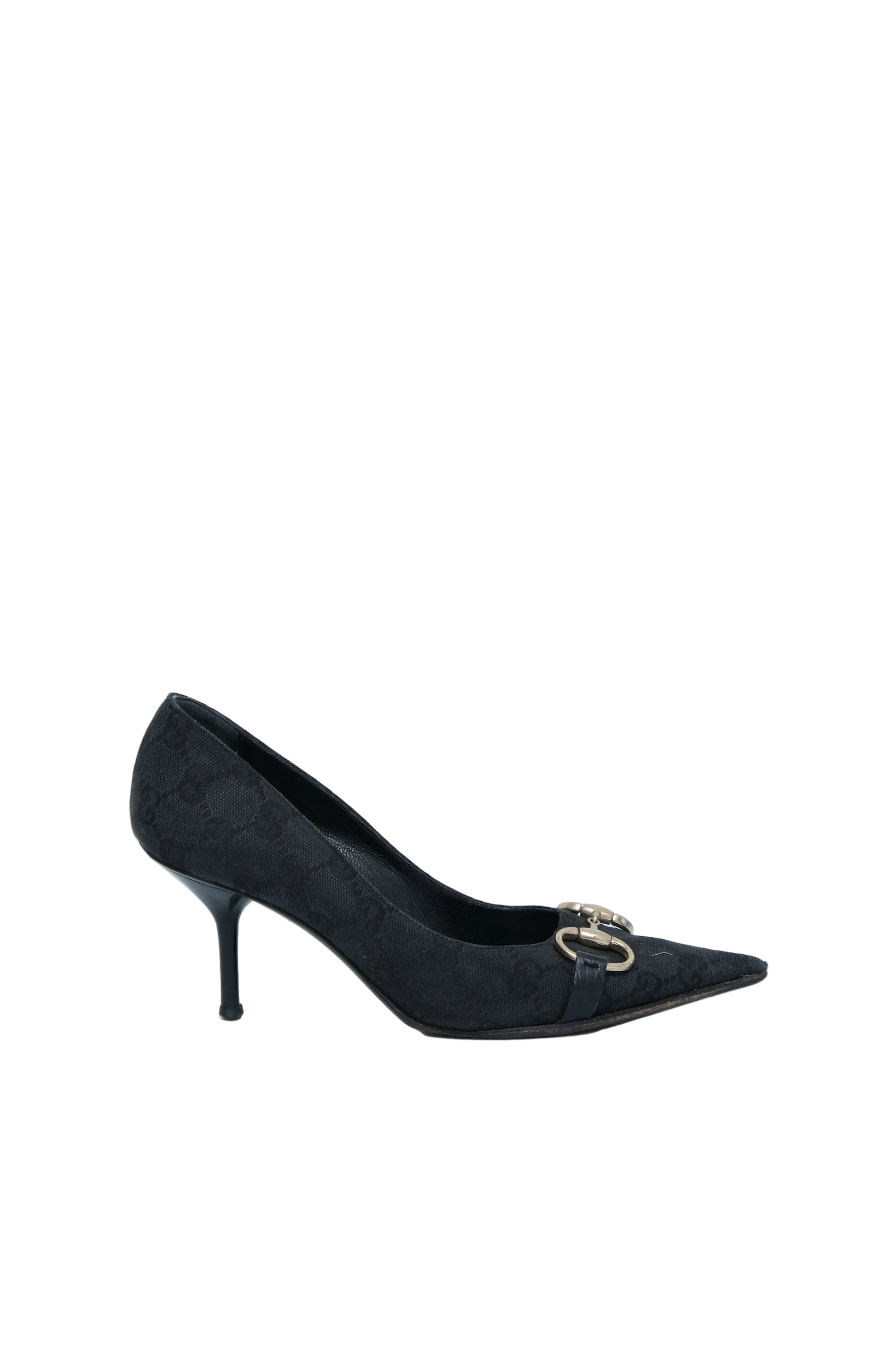 A single black pointed-toe kitten heel pump with a small gold-tone horsebit hardware detail on the vamp, shown against a light gray studio background.