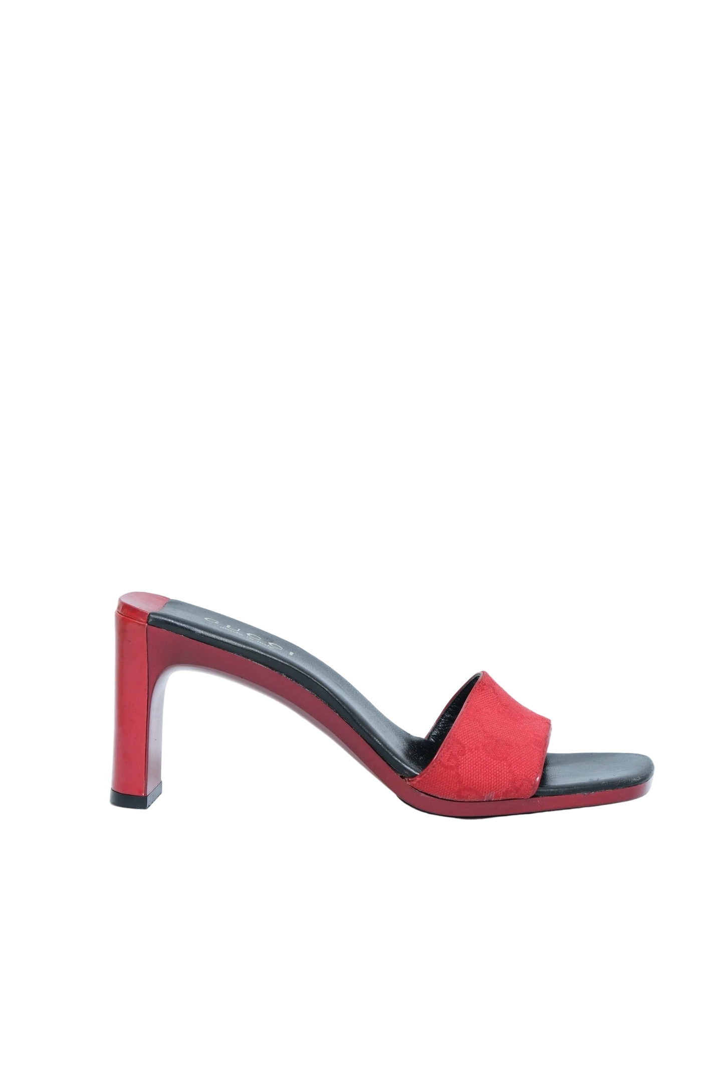 A red open-toe block-heel mule sandal with a black insole and trim, shown in profile against a light gray background.