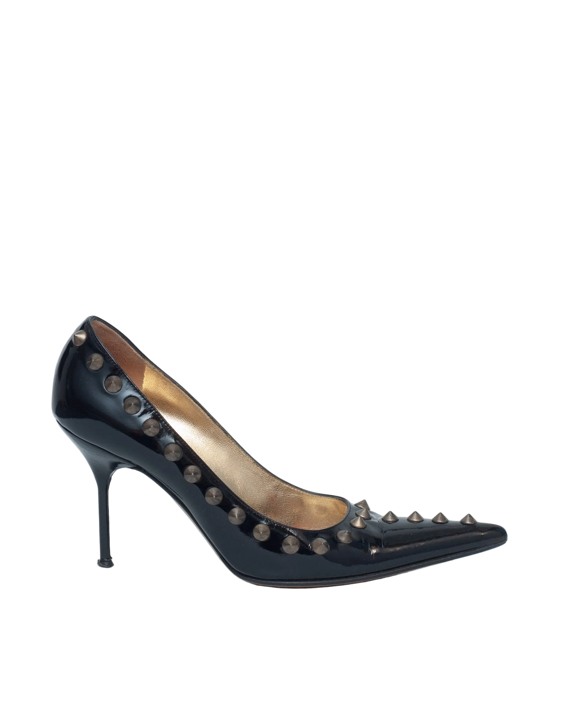Black high-heeled shoe with studded details on a white background