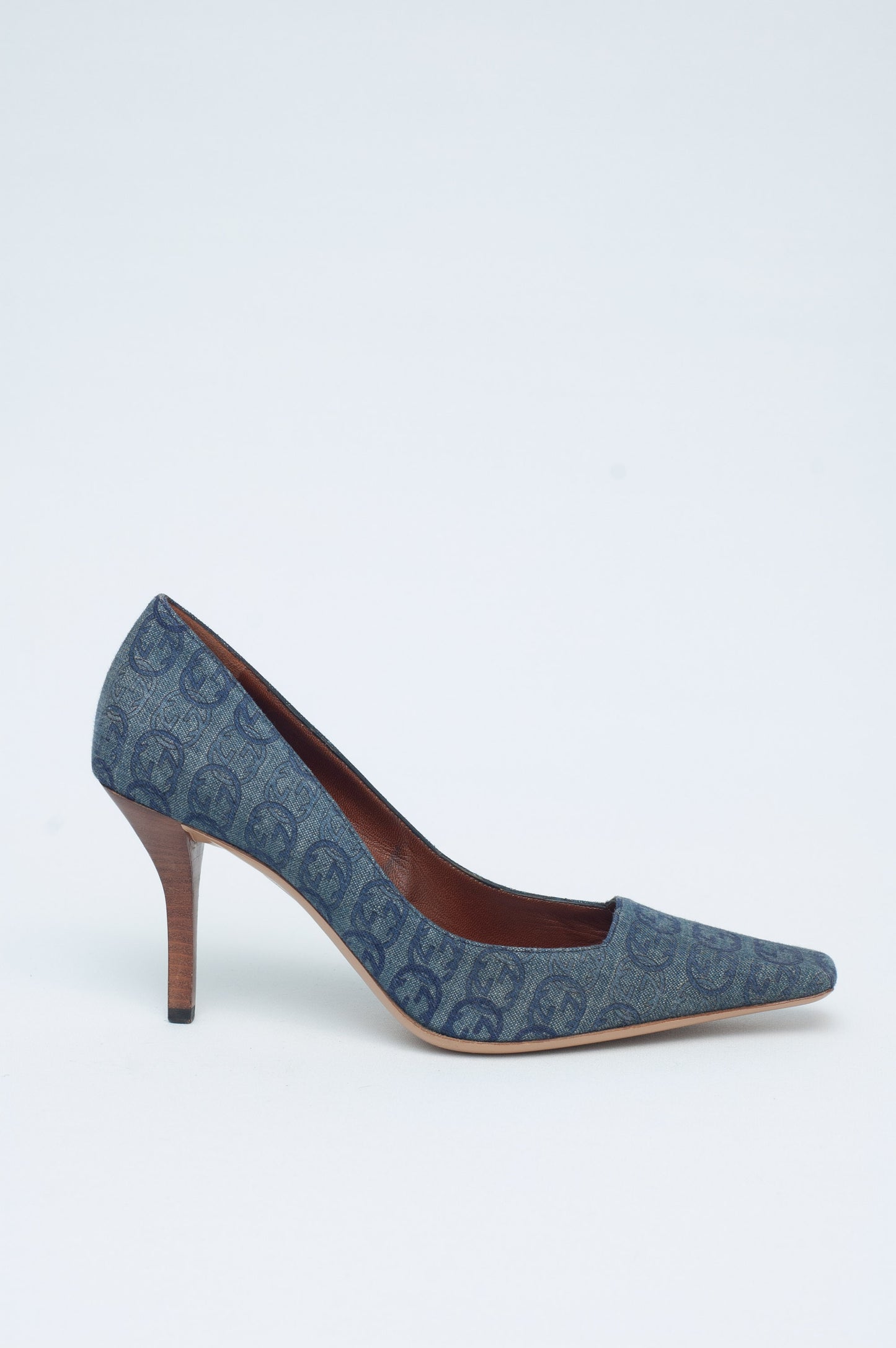 Blue patterned high-heeled shoe on a white background