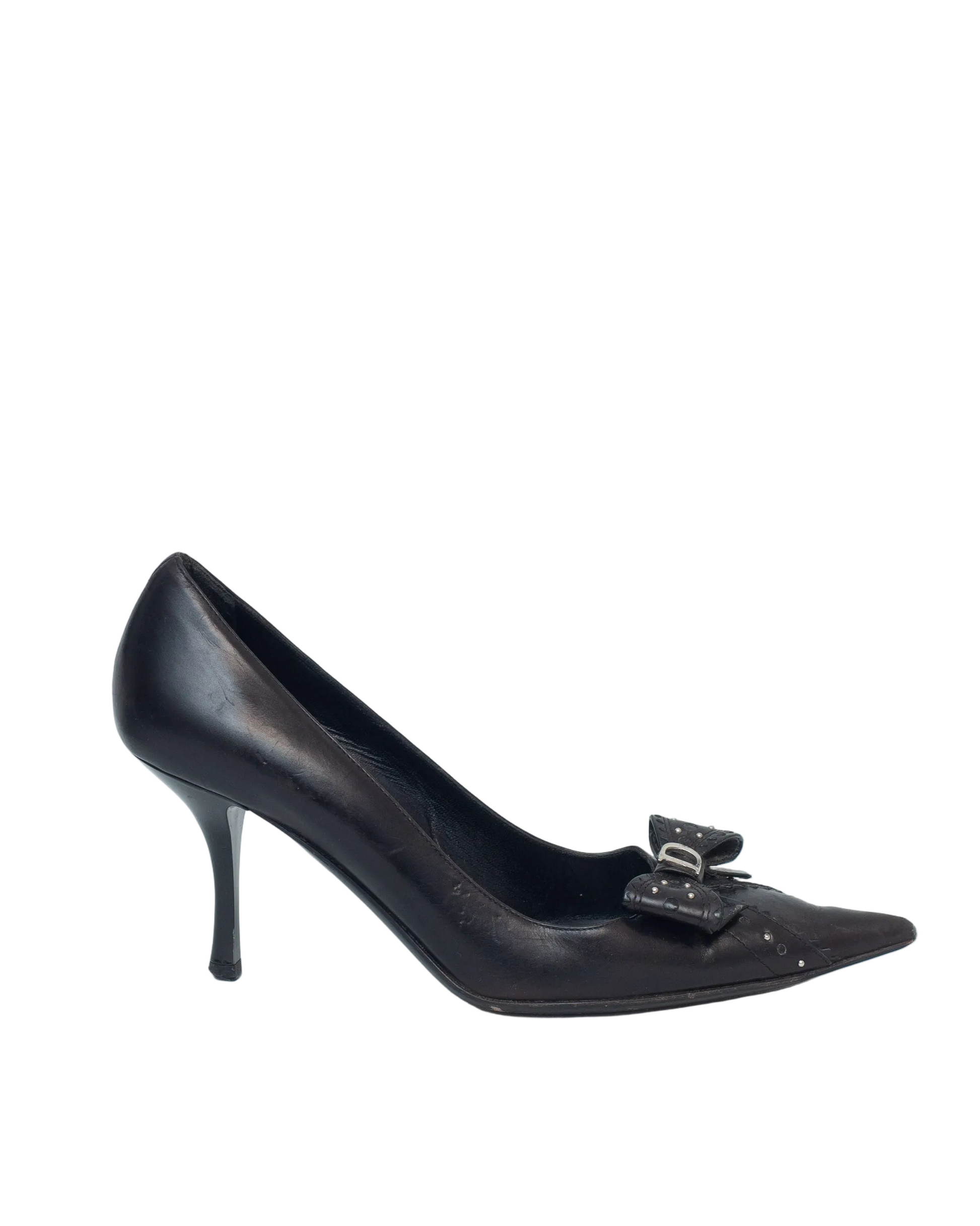 Black high-heeled shoe with a bow detail on a white background