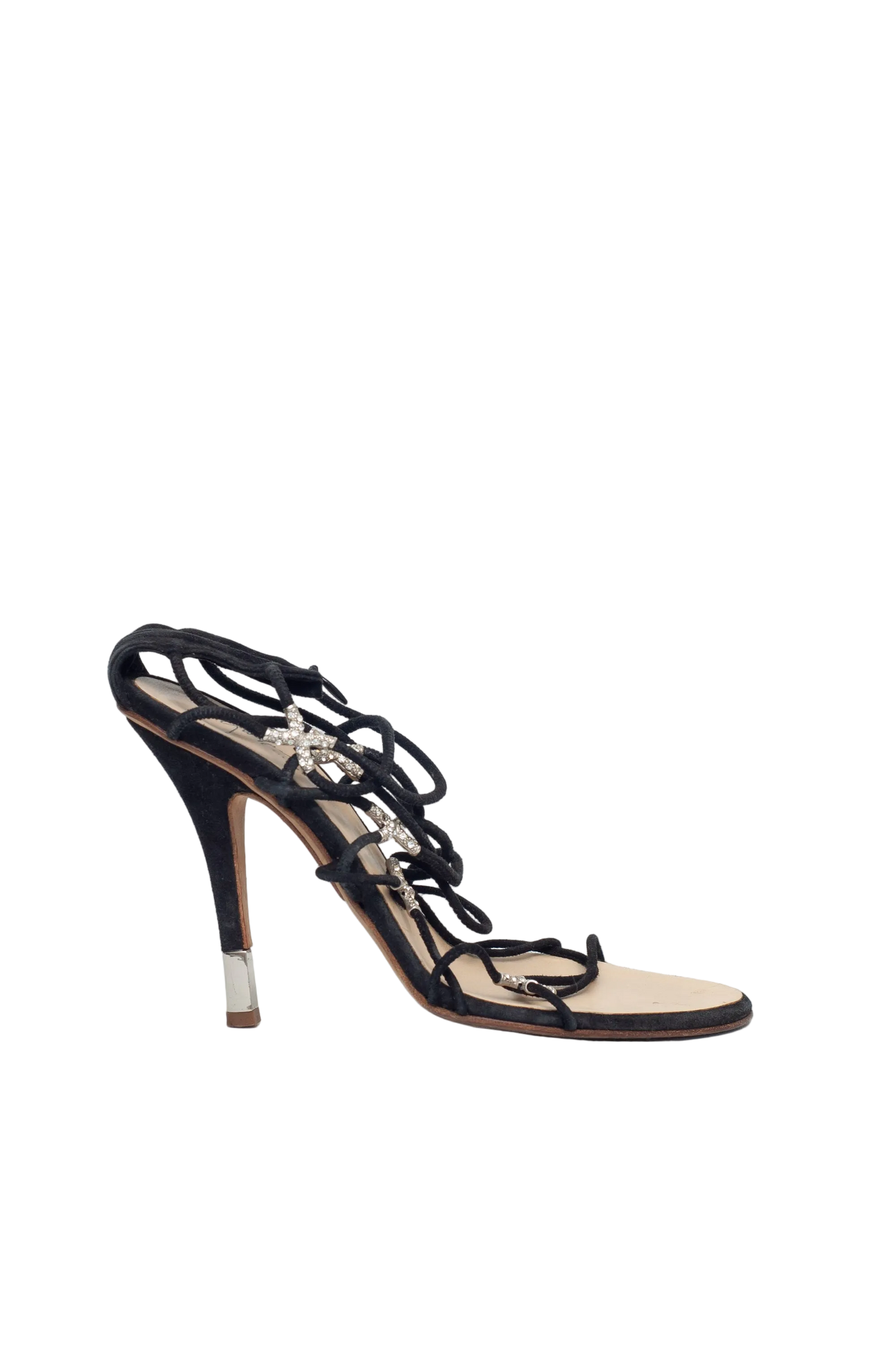Black high-heeled sandal with intricate design on a white background