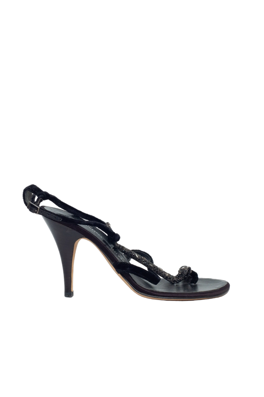 Black high-heeled sandal on a white background