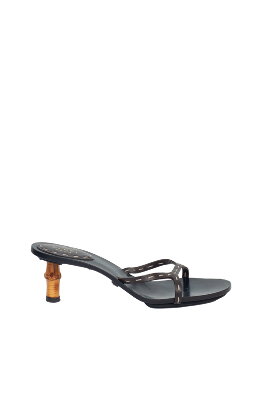 Black sandal with a wooden heel on a white background