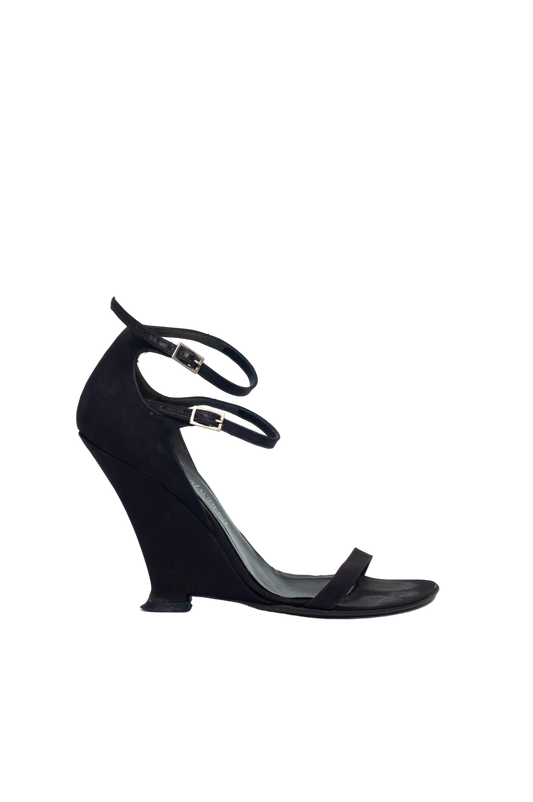 Black high-heeled sandal on a white background