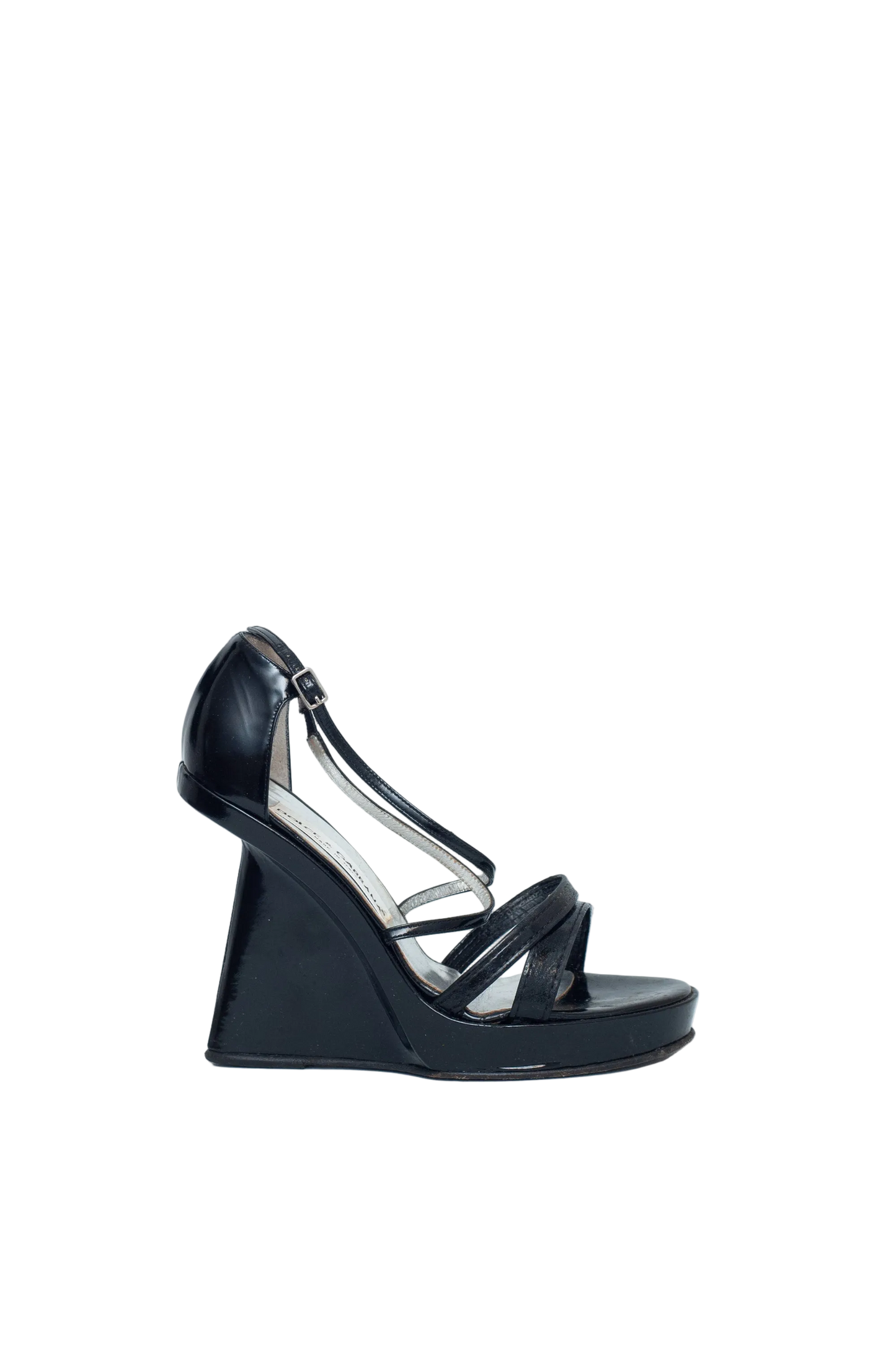 Black wedge sandal on a light gray background