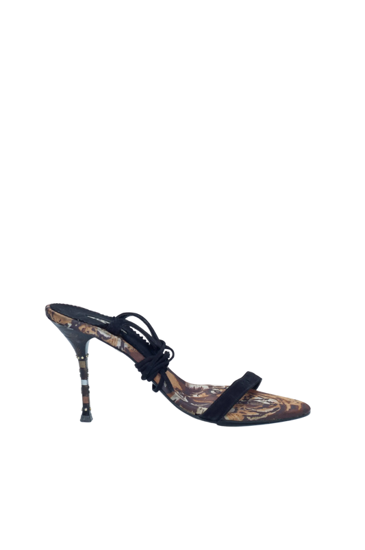 High-heeled shoe with intricate design on a white background