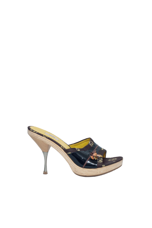 High-heeled shoe on a light blue background