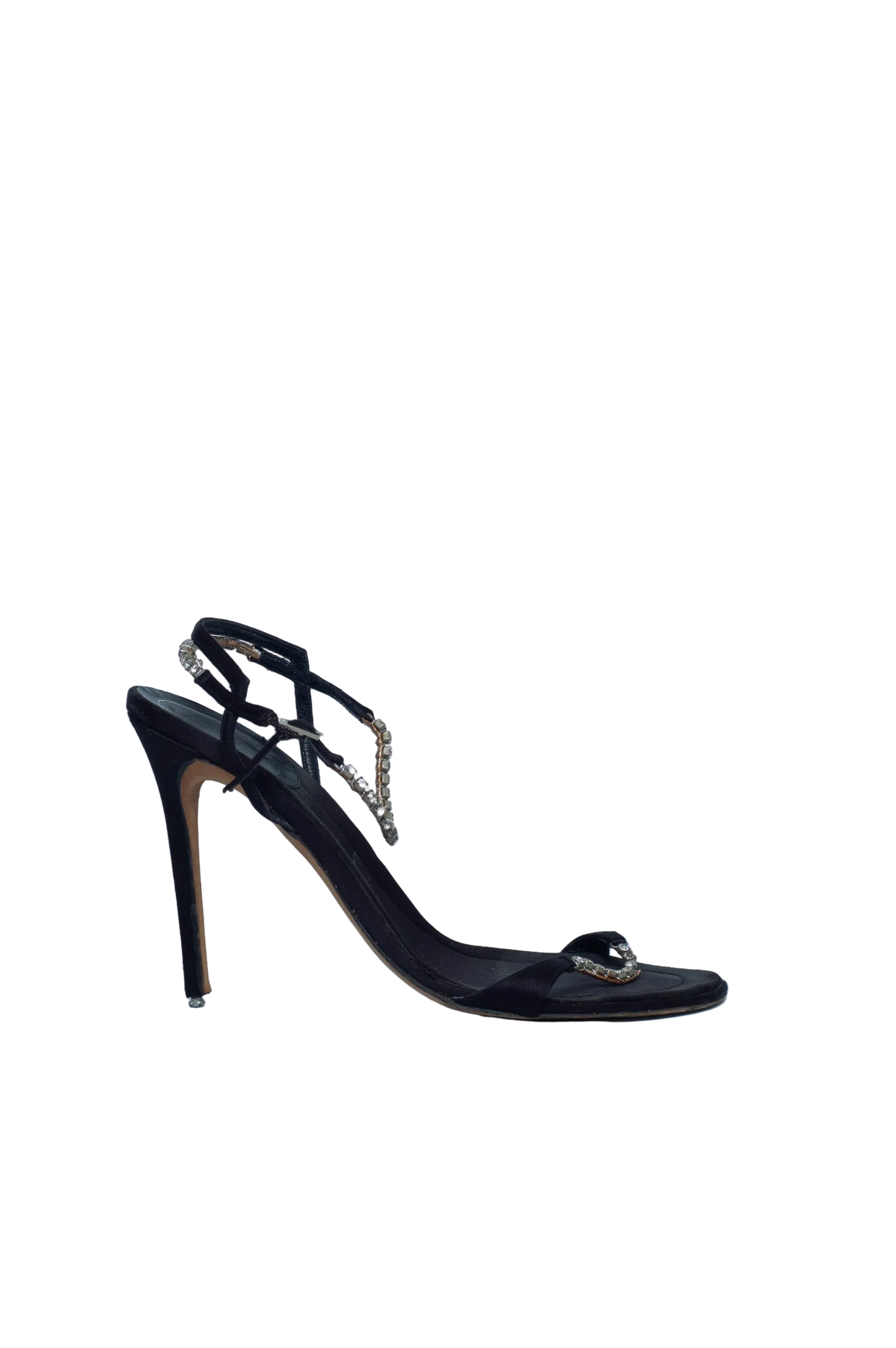 Black high-heeled shoe with decorative elements on a light gray background